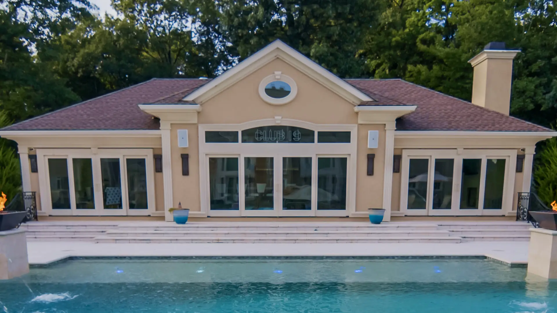 Formal gunite pool, spa and pool house designed and built by Artisan Landscapes and Pools